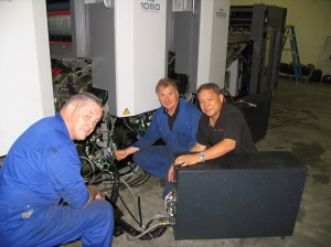 Installing the Ryobi 1050 at Wickliffe, from left: Bob Summers, print maintenance; Chris Godfrey, Cyber New Zealand service manager; Peter Chan, Cyber Malaysia service manager